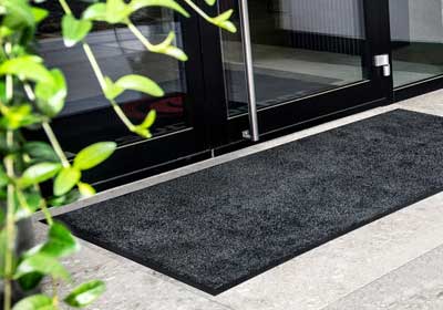 Heavy-duty anti-slip mat on industrial warehouse floor – UK safety flooring solution