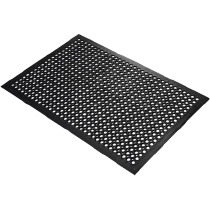 Industrial mats rolled out across a factory floor to improve safety and cleanliness