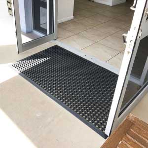 Heavy-duty industrial mats in a UK warehouse environment