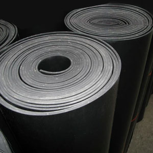 Industrial-grade silicone sheeting installed on a busy factory conveyor line to provide thermal barrier